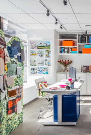 Img 3 California Closets New York City Custom Commercial Space White Office Custom Bookshelves Storage Interior Design Studio with Closed Cabinets and two desk workspaces