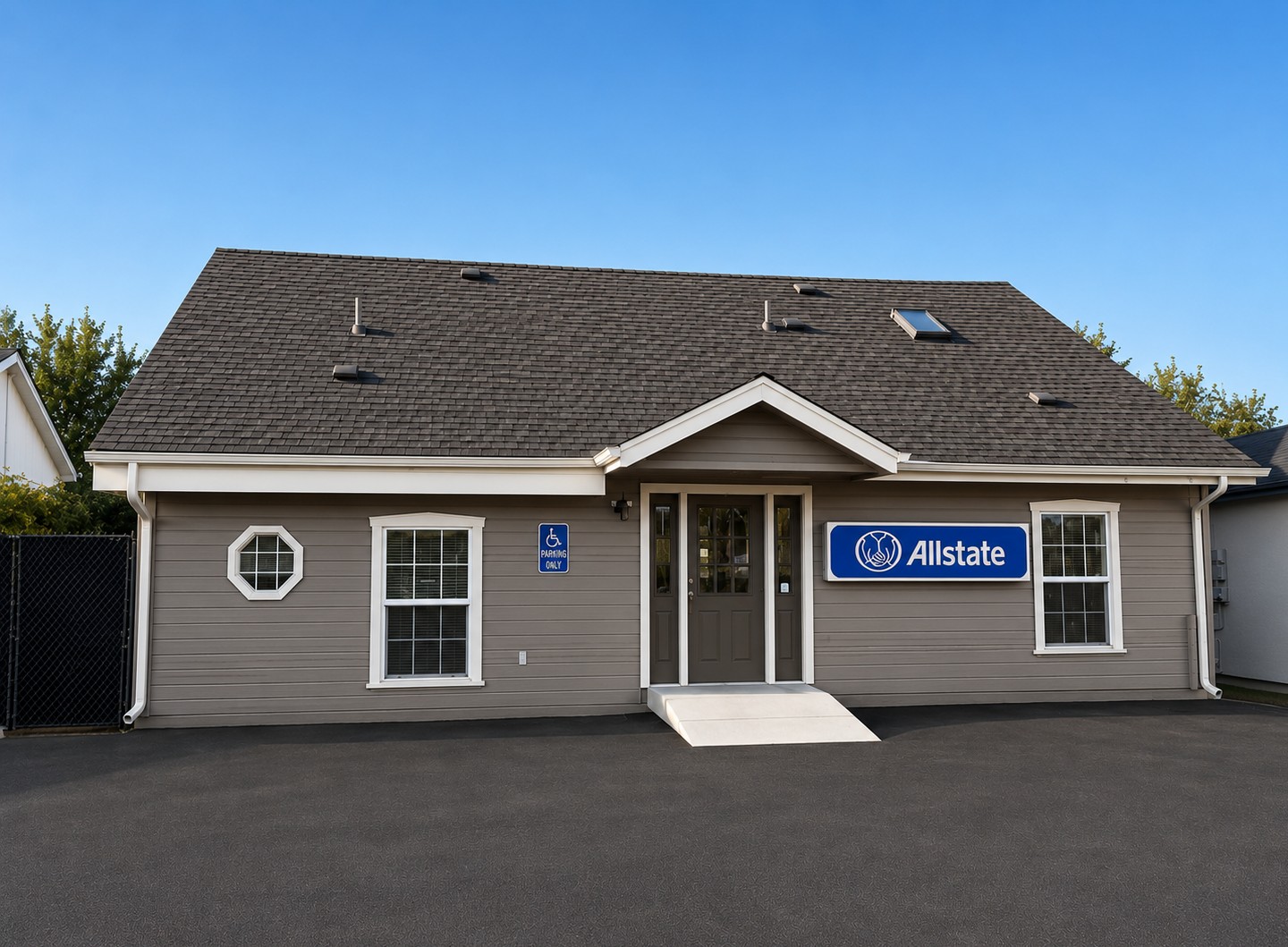 Rear parking lot and entrance of the agency. This parking can be accessed from 16th Street; the driveway is across from the car wash.