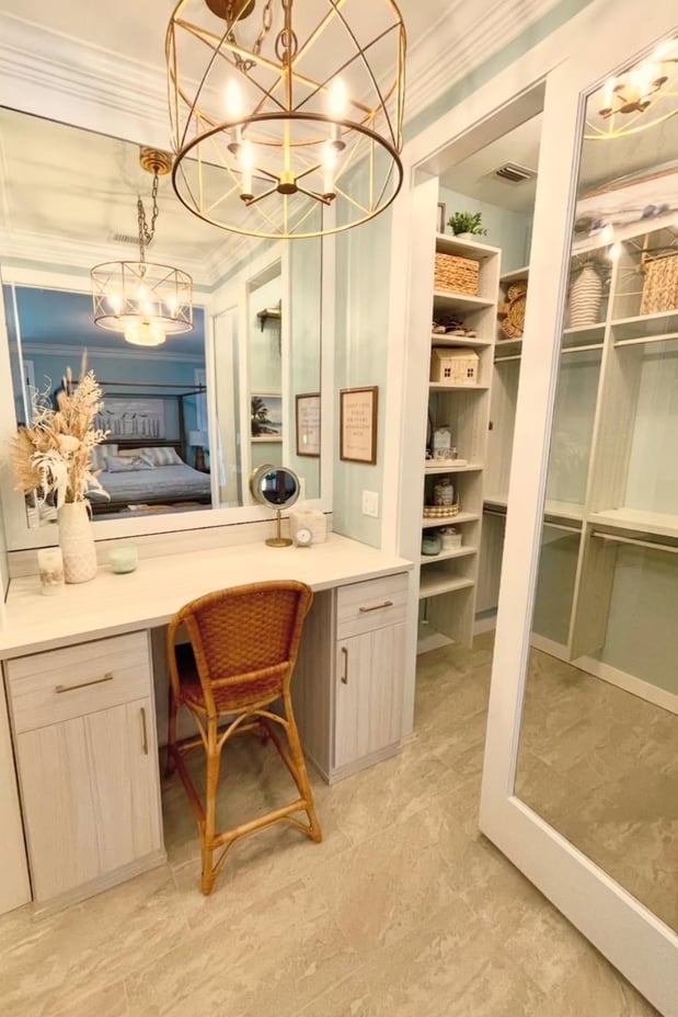 Custom vanity and walk-in closet in Tuscan Moon finish, featuring Elite handles in matte nickel for a sleek, modern, and functional storage solution.