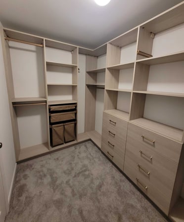 Custom Walk-in closet with baskets, drawers, and shelves