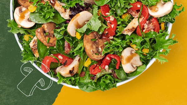 Our new Super Shroom Salad features spinach, spring mix, balsamic marinated mushrooms, fresh mushrooms, grilled chicken, bacon, roasted red peppers, roasted corn, and balsamic vinaigrette.