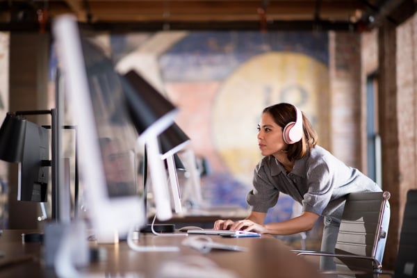 Woman working with computer and headphones