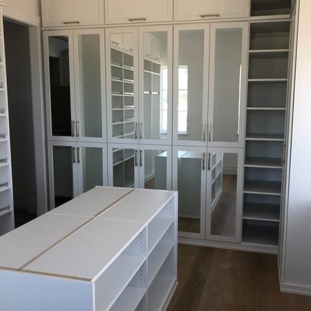 Richmond - Custom closets - mirrored cabinets, floor-to-ceiling shelves, and a functional center island