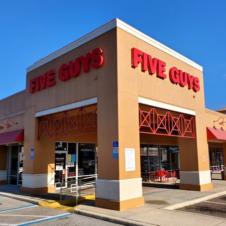 Store front of Five Guys at 300 East Lake Road in Palm Harbor, FL.