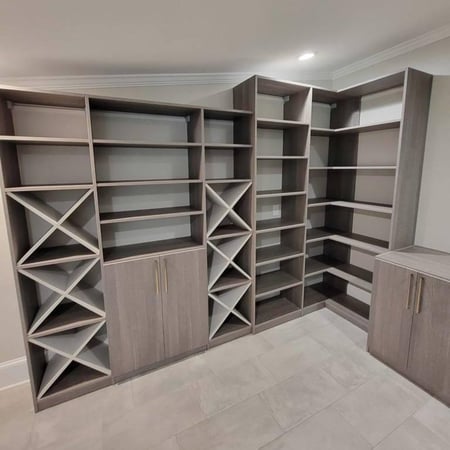 Greensboro - Custom closets - custom pantry featuring gray wood shelving, built-in wine racks, adjustable shelves, and lower cabinets with modern hardware
