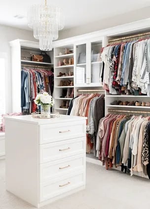 White walk-in closet with center island