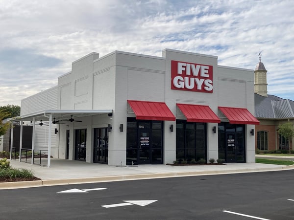 Exterior photograph of the Five Guys restaurant at 9016 Memorial Parkway SW in Huntsville, Alabama.