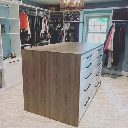 Brown custom closet system island with drawers California Closets Pensacola & Panama City, FL