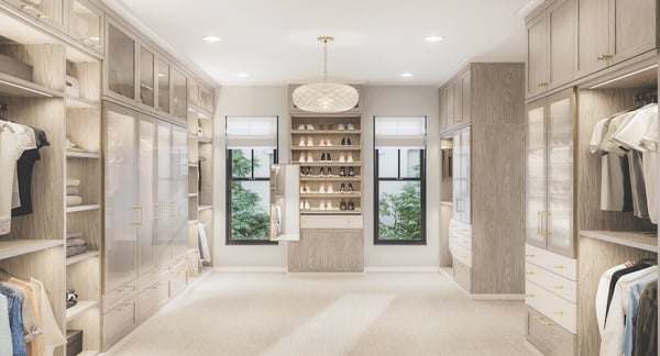 Luxury walk in closet with custom cabinets, glass doors, shelving, and closet systems for organized storage solutions