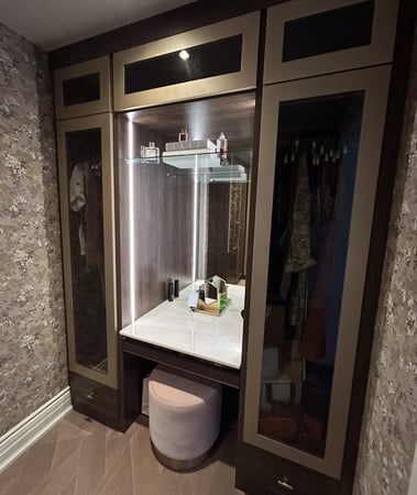 A moody vanity with side lighting and storage
