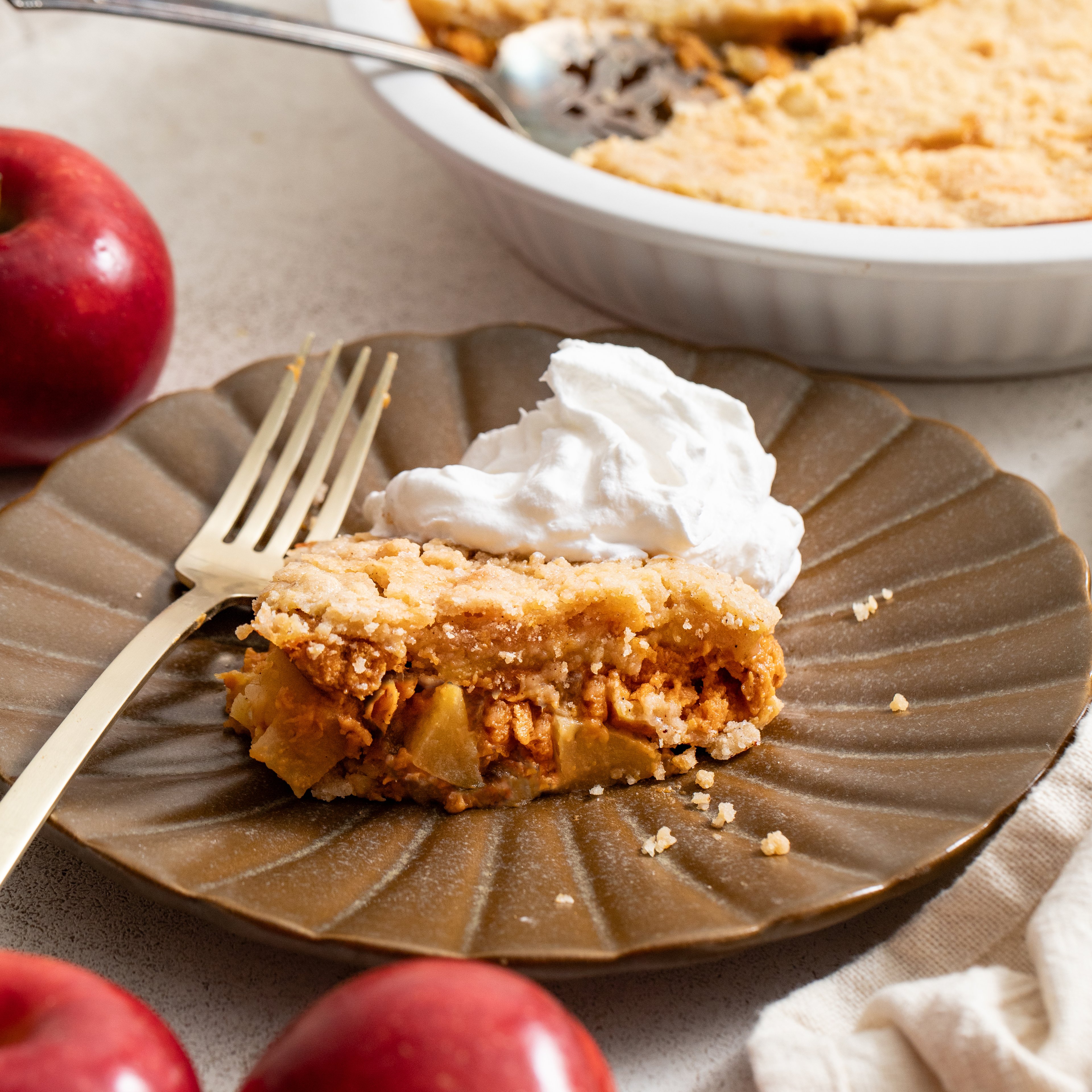 dutch style pumpkin spice apple crisp with whipped cream