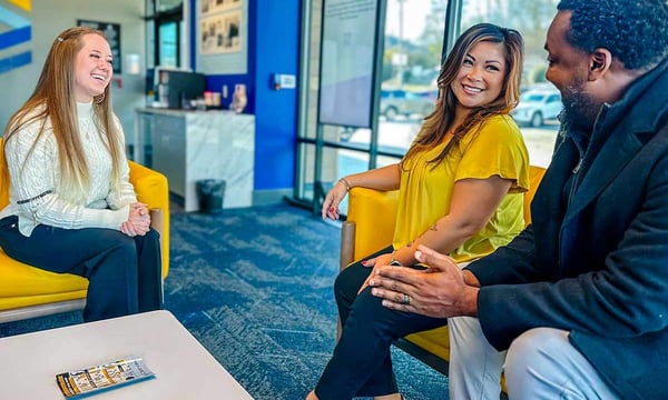 couple speaking with a clearview staff member