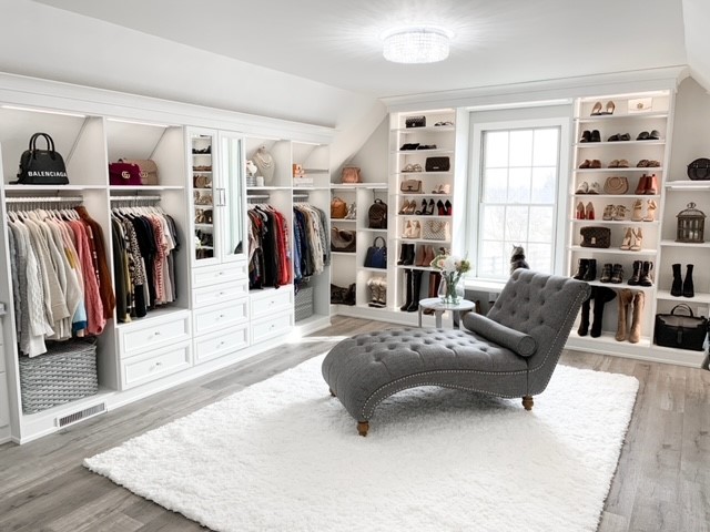 Luxury walk in closet with a variety of storage solutions for both clothes and accessories by California Closets Pittsburgh in Pittsburgh, Pennsylvania. Closet organization with closet organizers in an expert crafted closet system.
