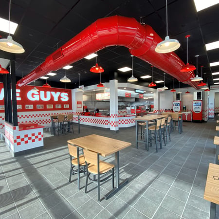 A photograph of the dining room and kitchen of the new Five Guys restaurant at 2409 MacArthur Road in Whitehall, Pennsylvania.